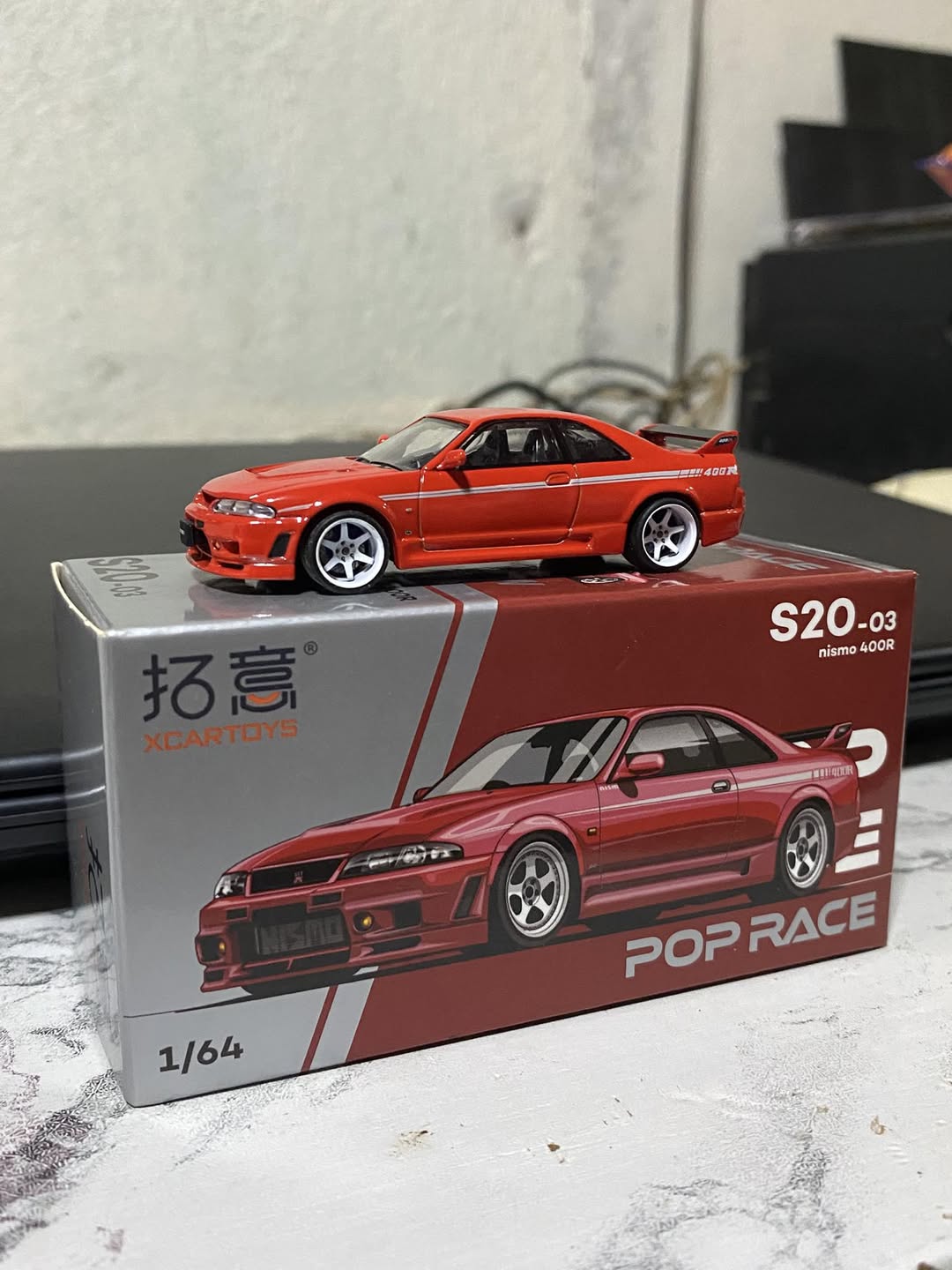 POP RACE x XCARTOYS 1:64 Nissan Skyline GT-R R33 Nismo 400R Red