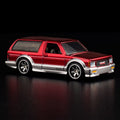 Hot Wheels RLC 1992 GMC Typhoon Spectraflame red JCP13 — Front three-quarter view