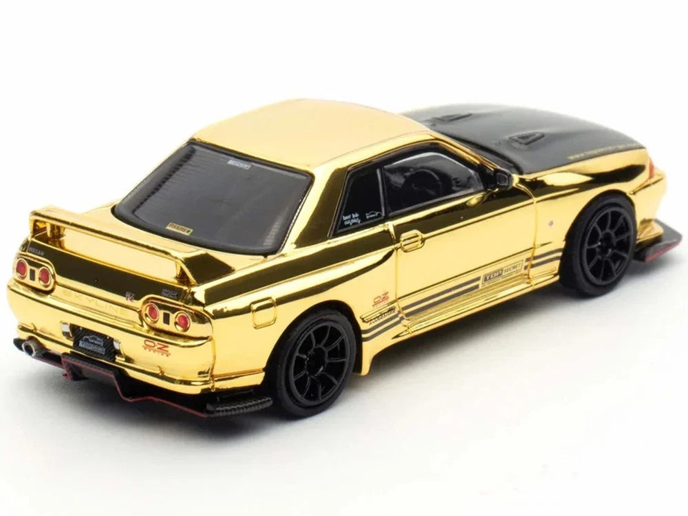 INNO64 Nissan Skyline GT-R R32 Top Secret Gold Chrome TMCS 2025 — Rear three-quarter view