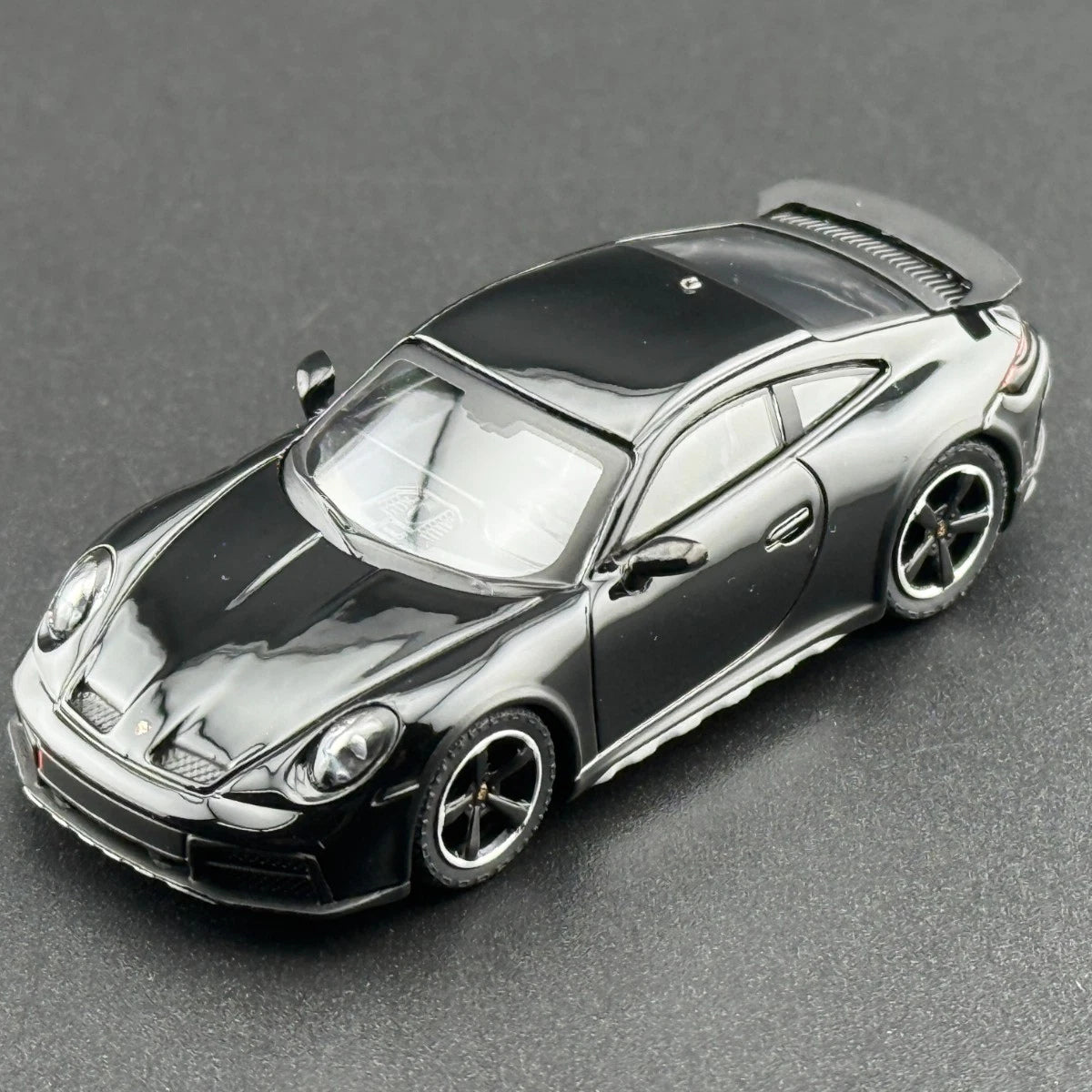 MINI GT 958 Porsche 911 Dakar Black overhead front view