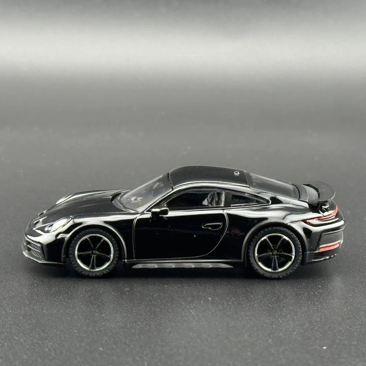 MINI GT 958 Porsche 911 Dakar Black side profile